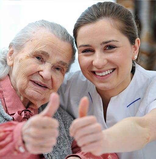 Elderly lady with carer